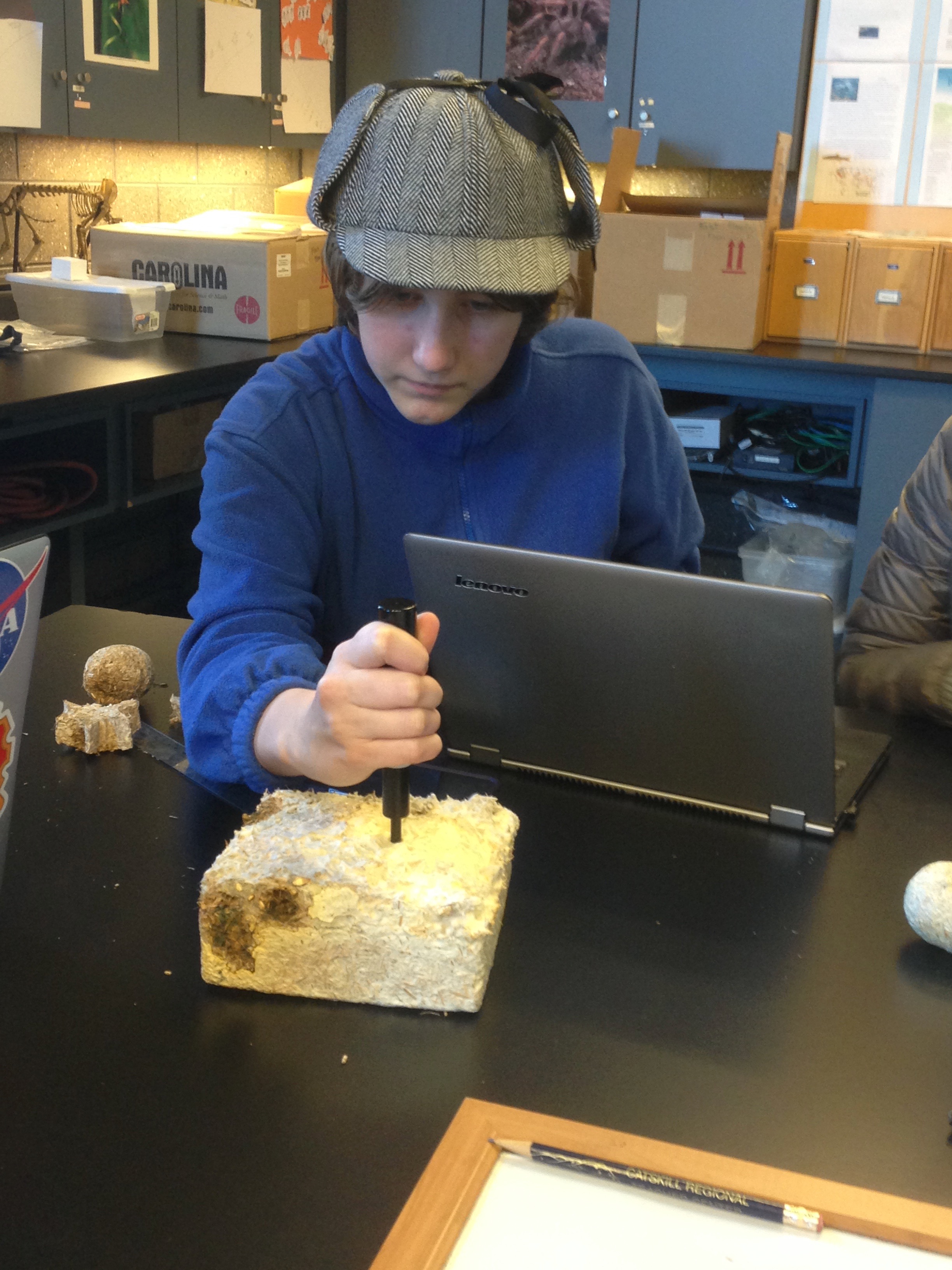 Student testing grown GIY block.